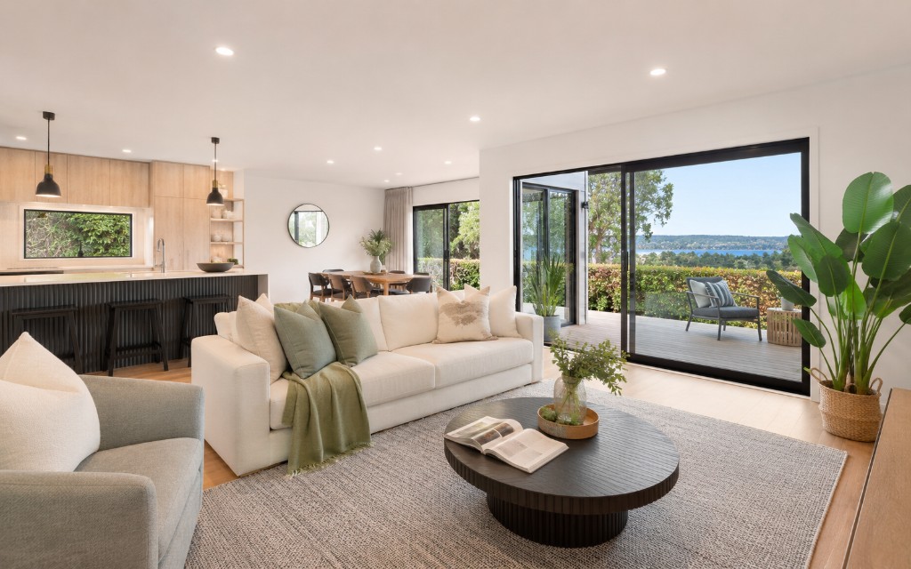 Bright open-plan living and kitchen interior photographed for an Auckland property listing